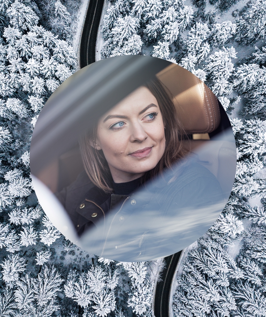 Woman driving on winter road